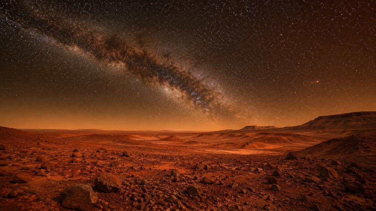 赤い火星の大地と星空のイメージ